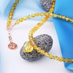 Vergoldetes Silbercollier mit Bernstein und Herz